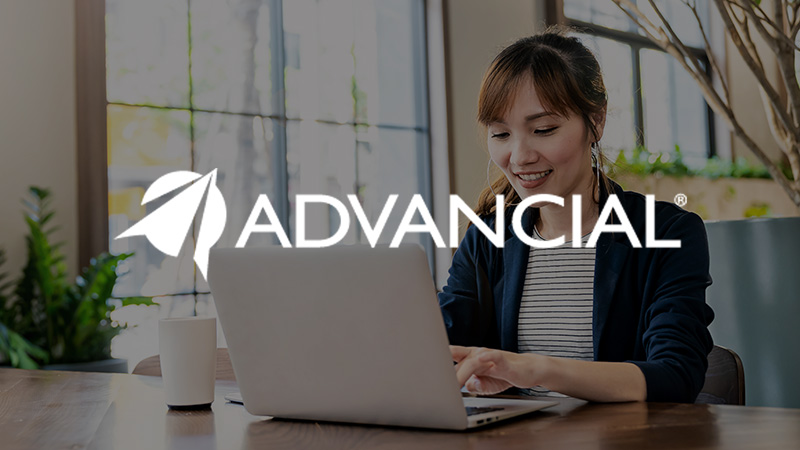 Advancial logo overlaying imagery of woman at a laptop.