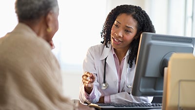Female doctor explaining to a male patient